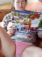 Classy-looking whore is posing seminaked for fun