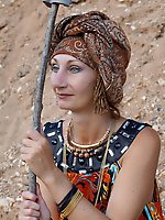 With spear wearing in colorful dress