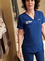 Mature slut is posing seminaked for fun