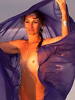 Beautiful sunset scenery by the shore of a salt lake, featuring a blue shawl