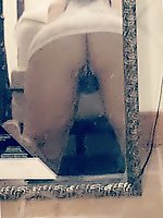 An older woman is manually stimulating herself